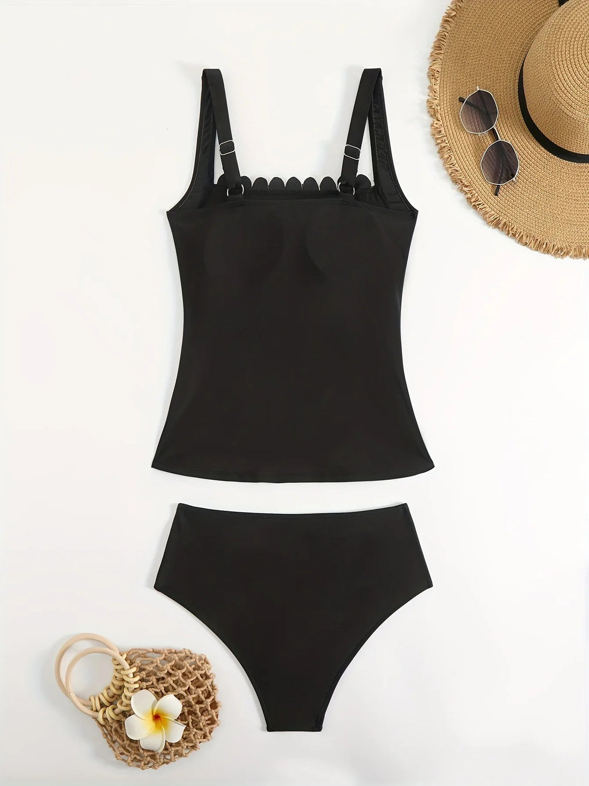 Black two-piece swimsuit with ruffled neckline and straps, perfect for summer beachwear, by The Clothing Company Sydney.