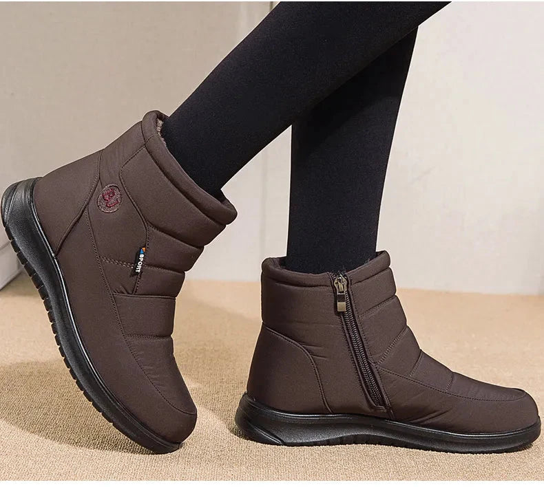 Women’s ankle low heel snow boots by The Clothing Company Sydney, winter flat shoes with waterproof design and cozy interior.