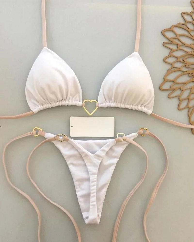 Solid color halter bikini set for women, two-piece swimsuit with triangle top and thong bottoms by The Clothing Company Sydney.