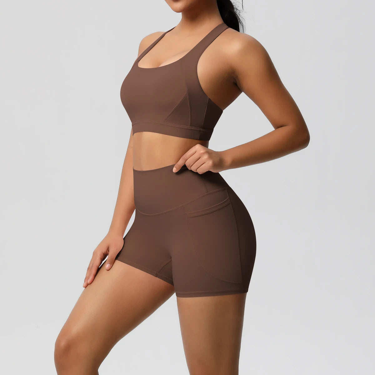 Women’s fitness yoga set with pocketed gym shorts, crossover bra, and leggings from The Clothing Company Sydney.