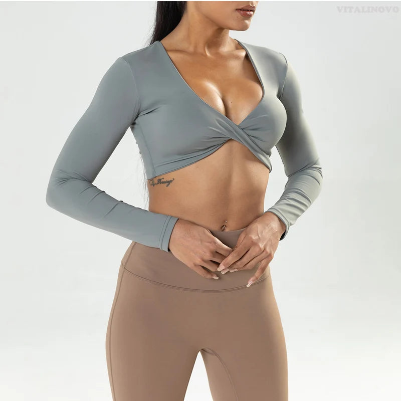 Long sleeve workout crop top by The Clothing Company Sydney with twist front, deep V neckline, quick-dry fabric, padded, for fitness and yoga.