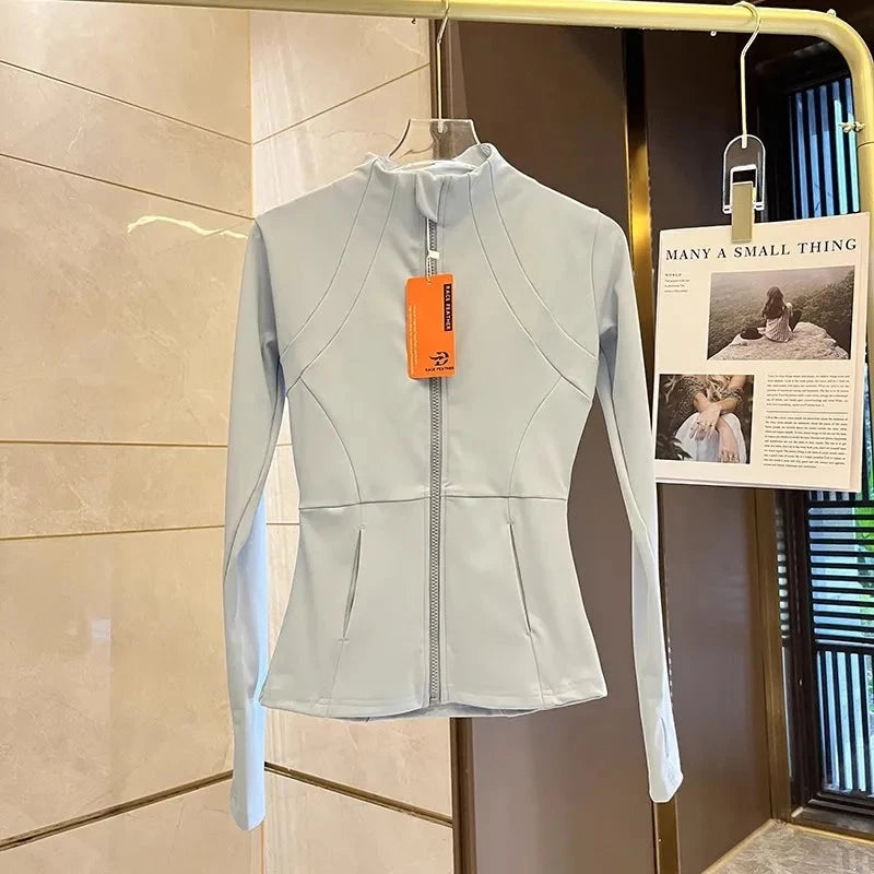 Women’s fitness zip-up sports jacket by The Clothing Company Sydney, long sleeve yoga and running top for warm gym workouts.