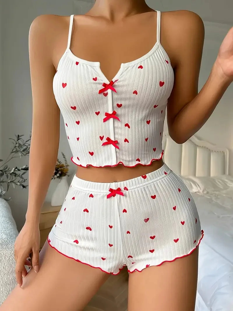 Women’s heart print pyjama set from The Clothing Company Sydney featuring a soft ribbed cami top and matching shorts with frill trim.