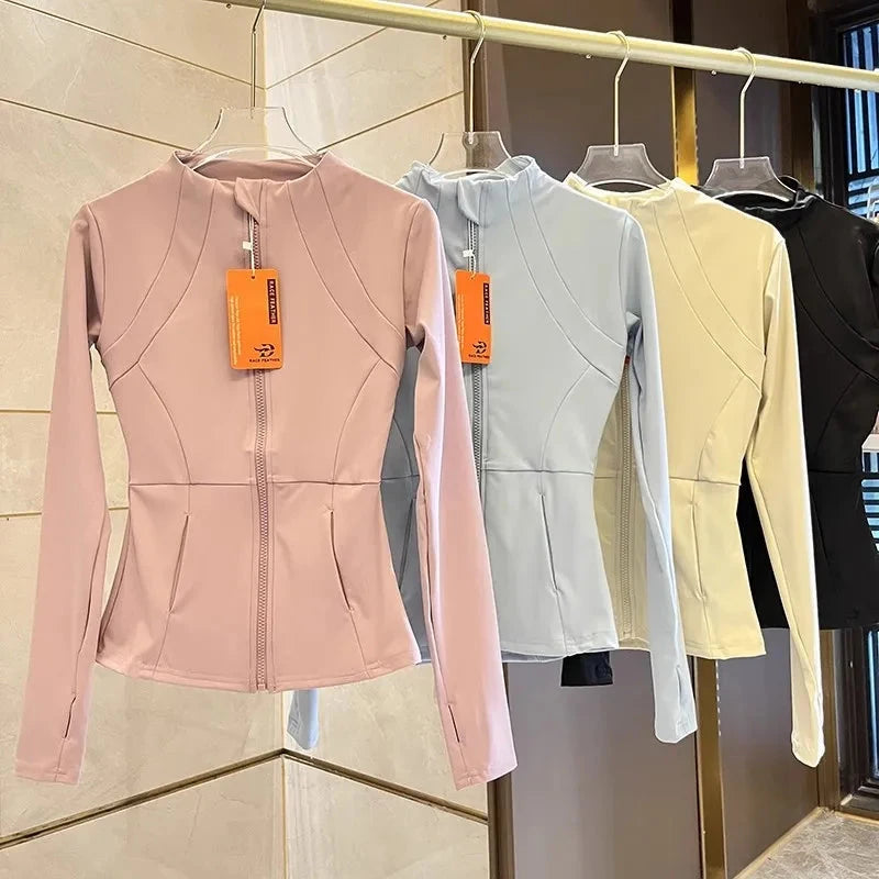 Women’s slim-fit sports jacket from The Clothing Company Sydney, long sleeve zip fitness top for yoga, running, and workout activities.
