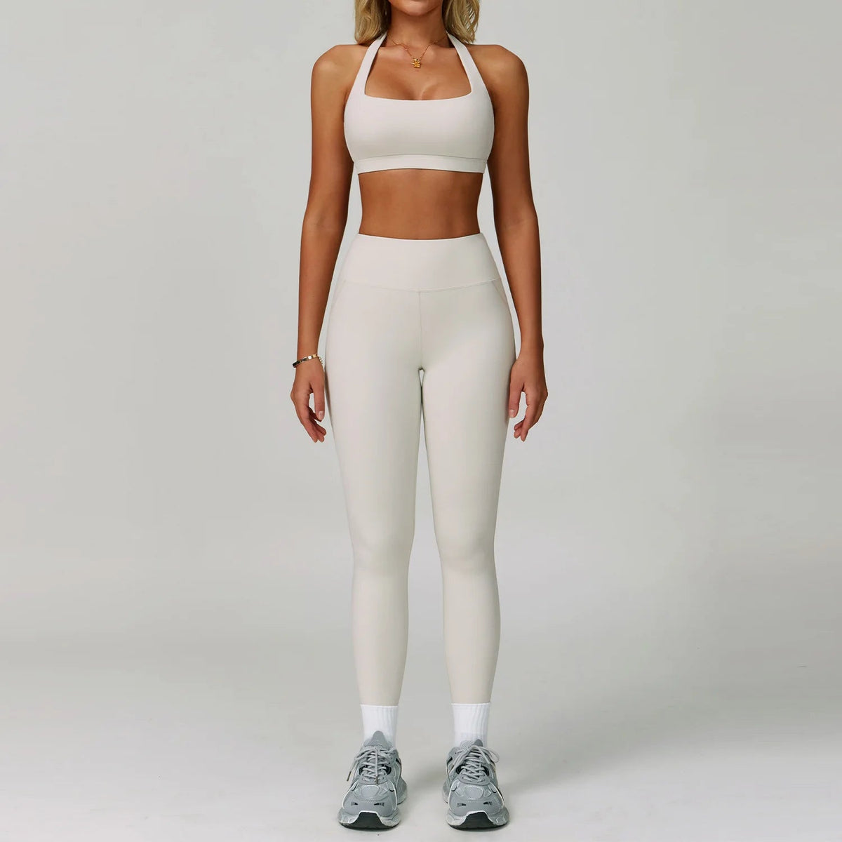 Women's fitness tracksuit set with high-waist leggings and sports bra from The Clothing Company Sydney, perfect for yoga and workouts.