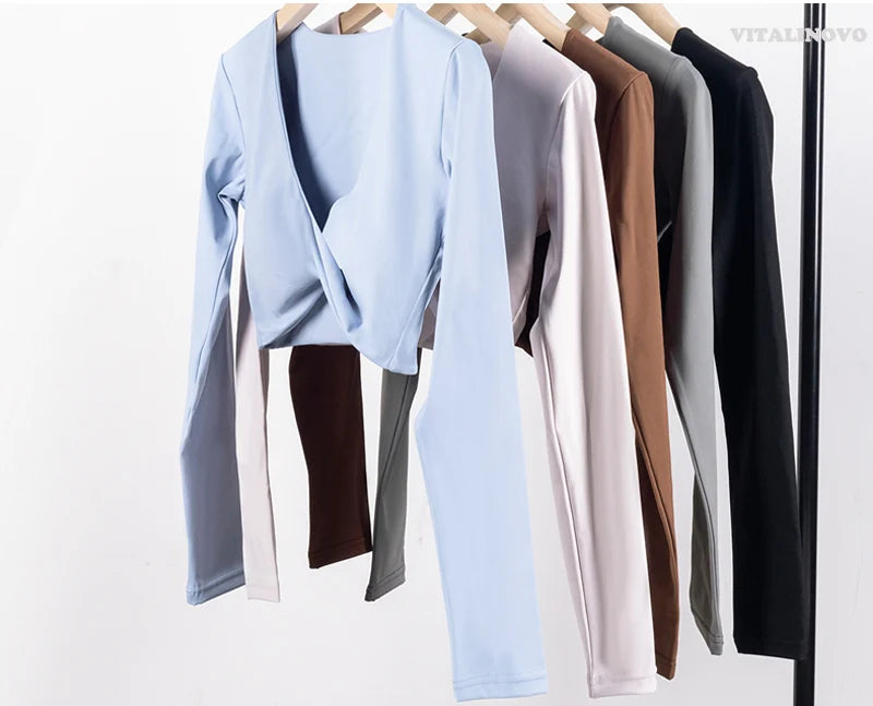 The Clothing Company Sydney long sleeve gym crop top with twist deep V neckline, quick-dry fabric, padded sports fitness yoga shirt.