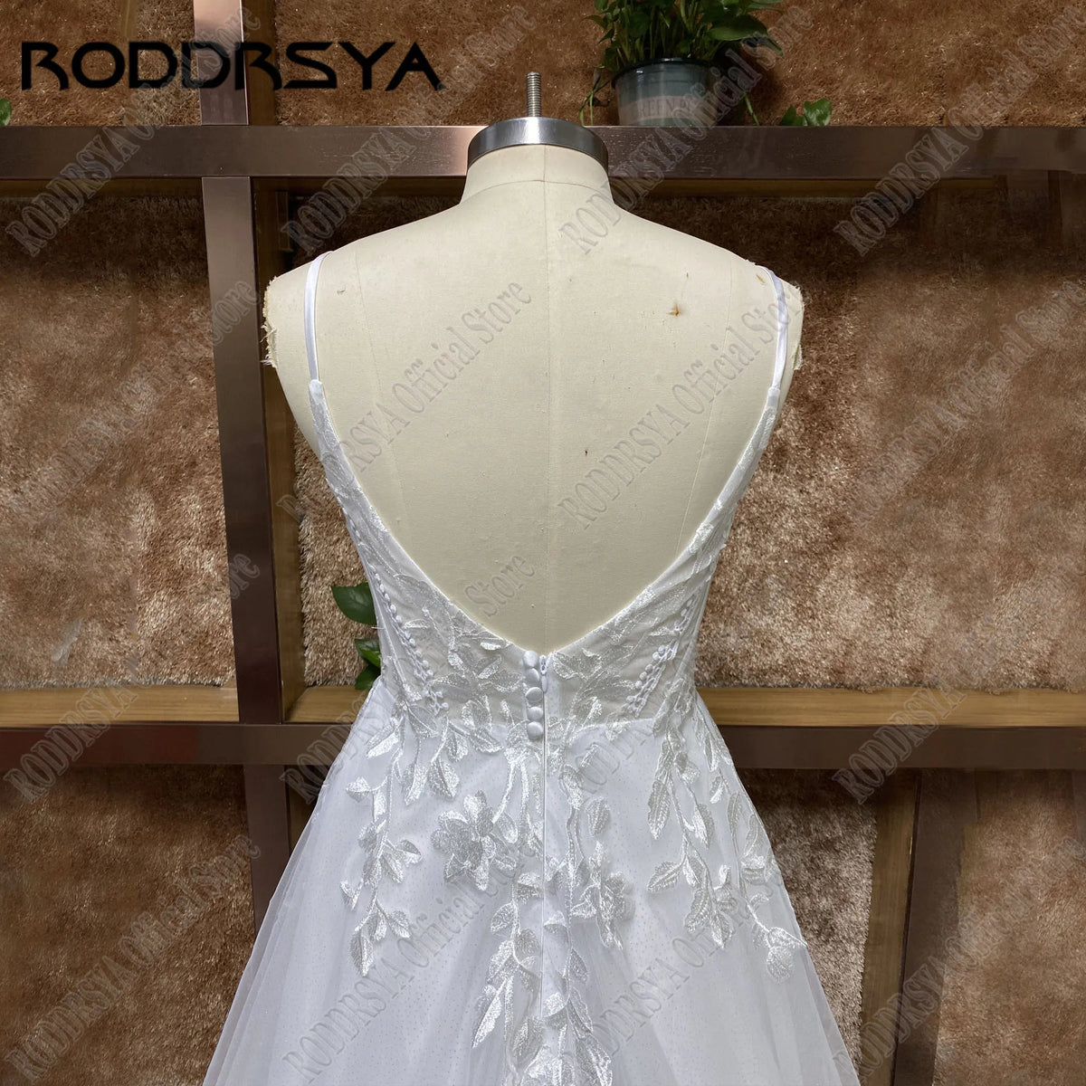 Elegant wedding dress with spaghetti straps, glitter V-neck, backless design, boho style, sweep train, customized by The Clothing Company Sydney