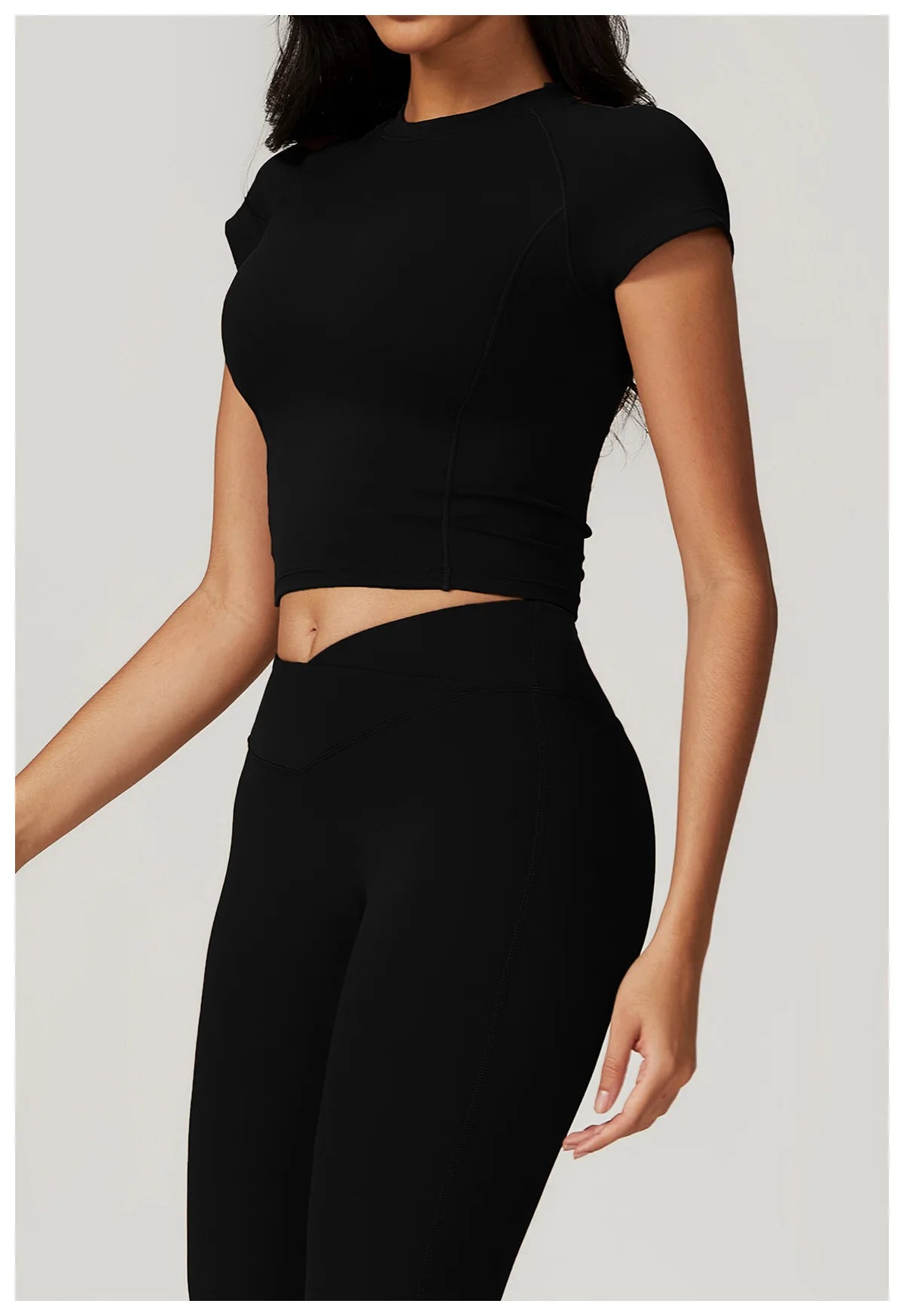 Two-piece women's fitness set with crop top and leggings, includes sports bra and bike shorts, by The Clothing Company Sydney.