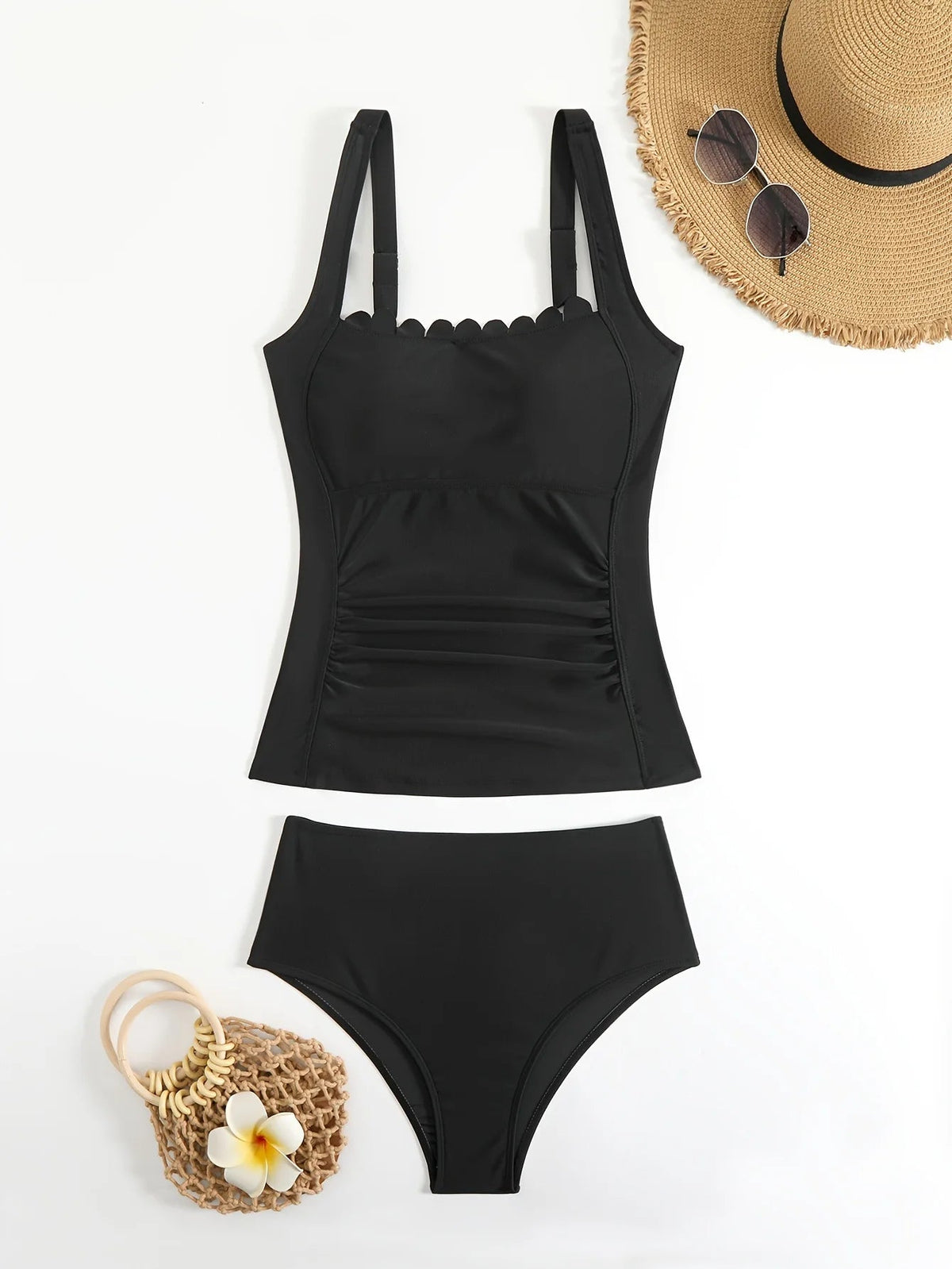 Black two-piece swimsuit with ruffled neckline and straps, perfect for summer beachwear from The Clothing Company Sydney.