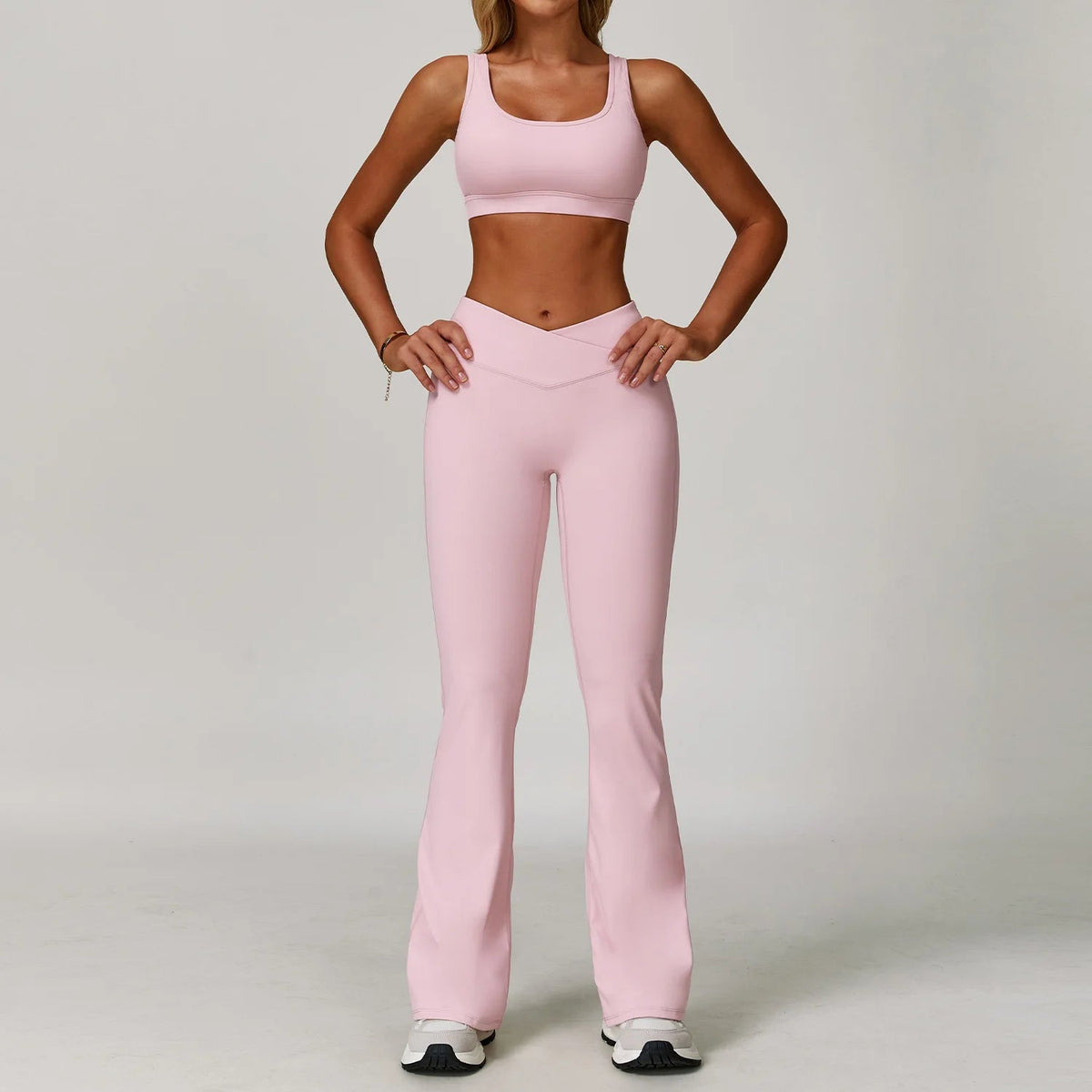 Two-piece women's sportswear set including sports bra and gym leggings, perfect for yoga, running, and fitness workouts.