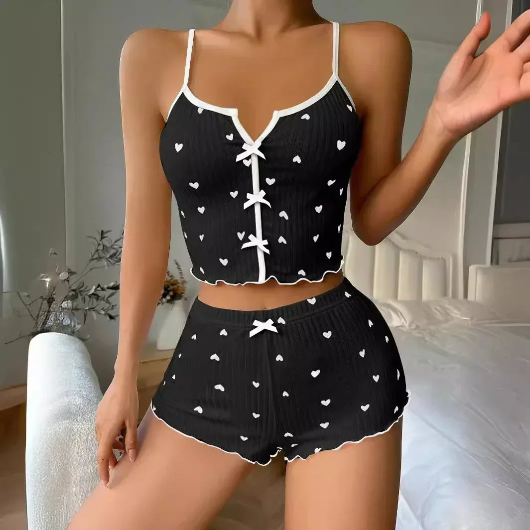 Women’s heart print pyjama set from The Clothing Company Sydney featuring a soft ribbed cami top and matching shorts with frill trim.