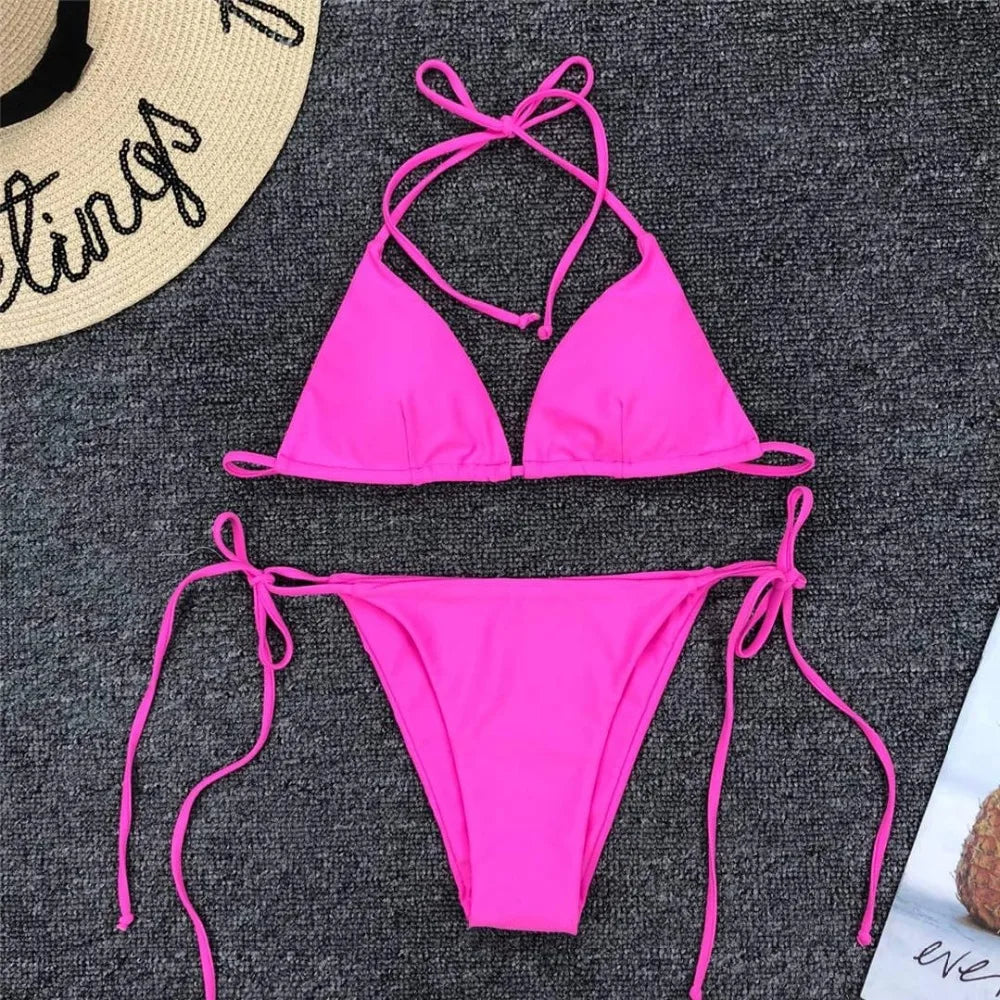 Neon pink Brazilian bikini set for women featuring a halter top and matching bottoms, perfect for beach or poolside swimwear.