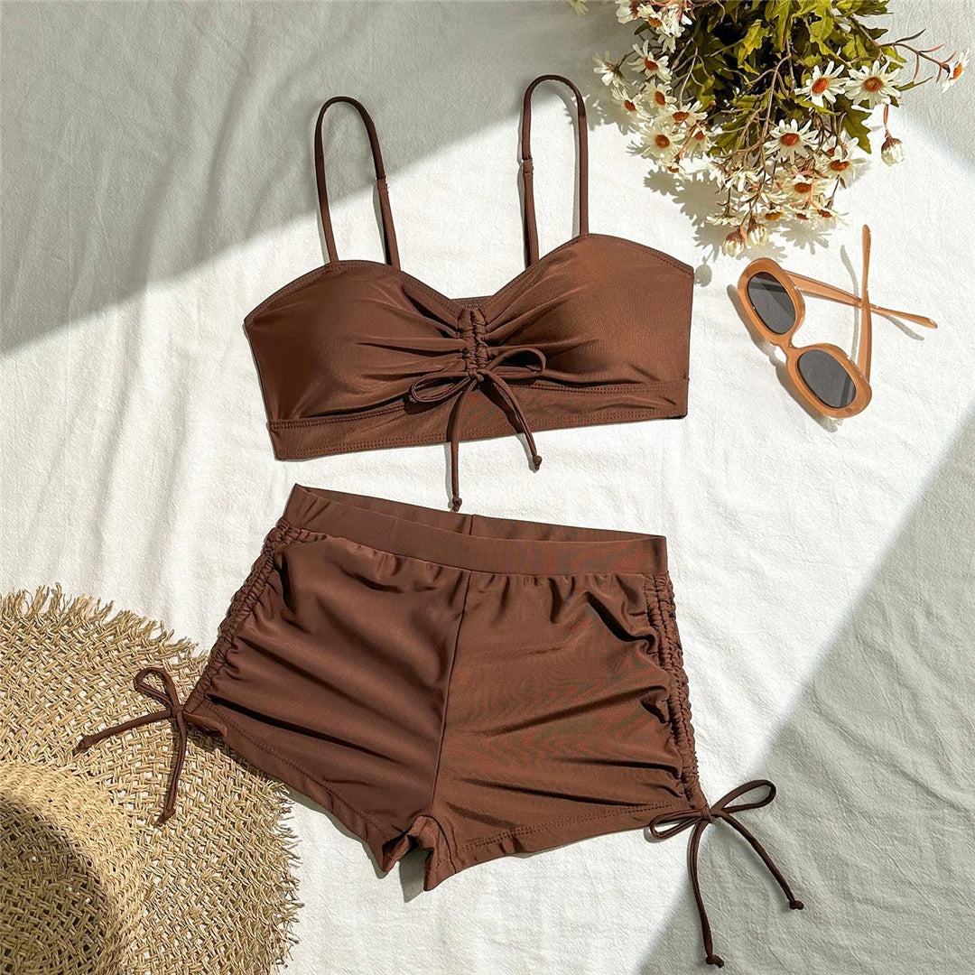 High-waist knotted shorts swimsuit by The Clothing Company Sydney, two-piece bikini set with wrinkled fabric and stylish design.