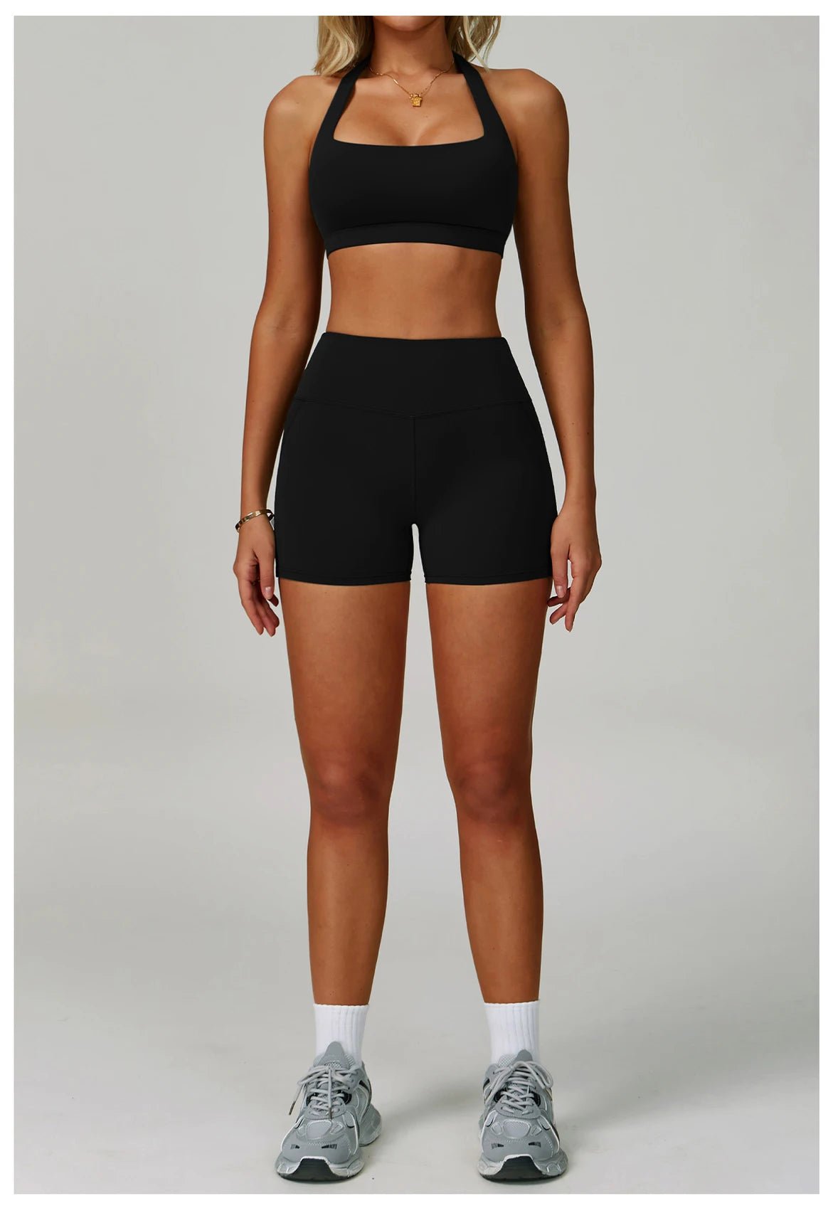 Women's fitness tracksuit set by The Clothing Company Sydney featuring high waist leggings and sports bra for yoga and workout.