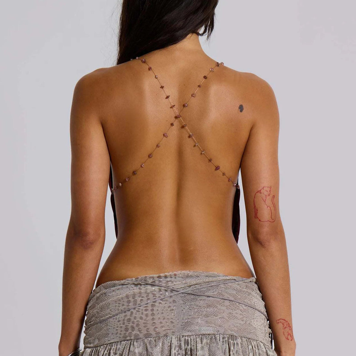 Women's Y2K style camisole top with deep V-neck, spaghetti straps, crop length, from The Clothing Company Sydney.