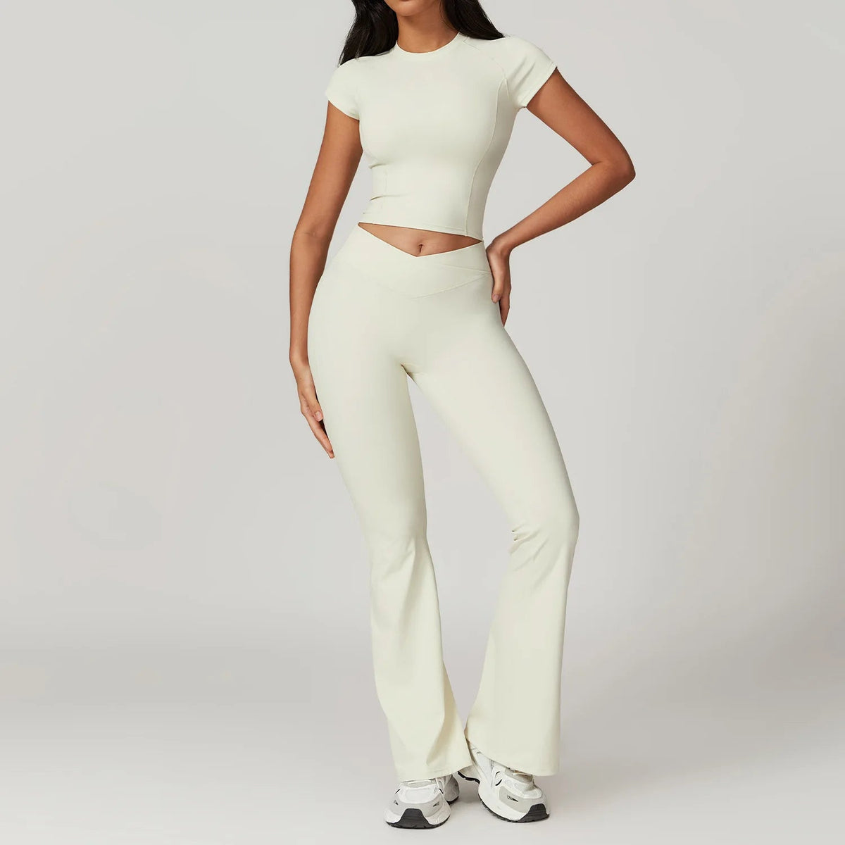 Two-piece women's fitness set including a crop top, sports bra, and leggings from The Clothing Company Sydney, ideal for yoga and workouts.