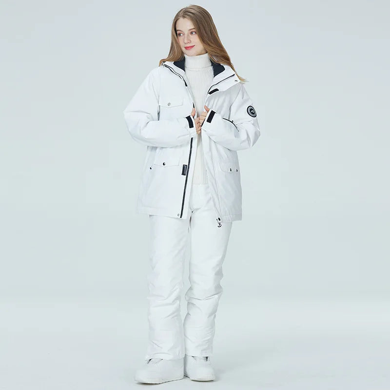 Women's waterproof ski suit by The Clothing Company Sydney, featuring a snowboard jacket and pants for winter snowboarding.