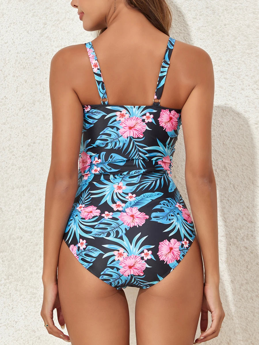 Floral printed one-piece swimsuit by The Clothing Company Sydney featuring cross design, suitable for swimming and beachwear.