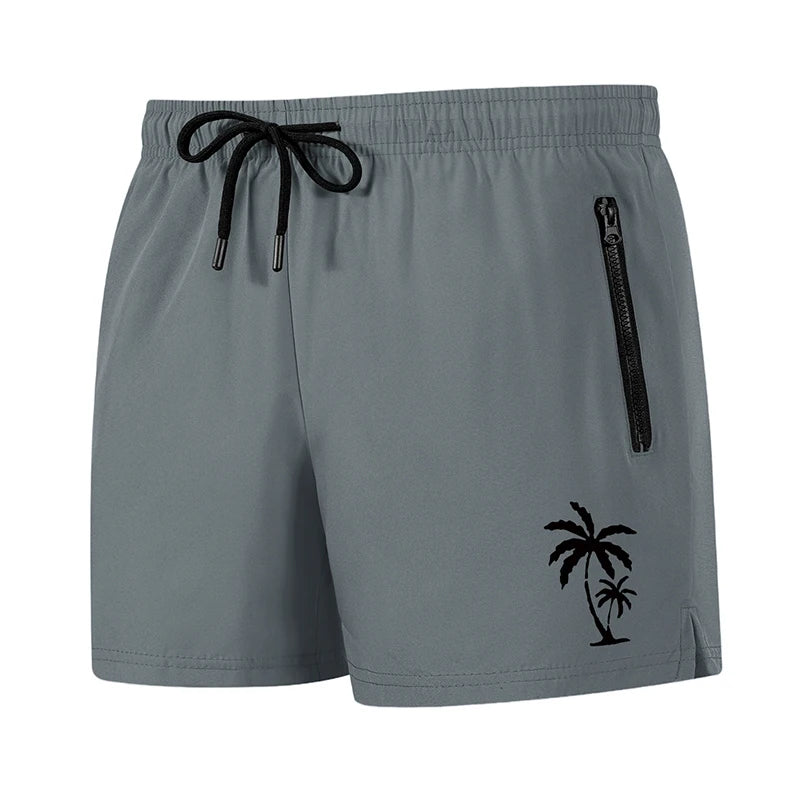 Men's palm tree print board shorts by The Clothing Company Sydney featuring quick-dry fabric, mesh liner, zipper pockets, summer beach style
