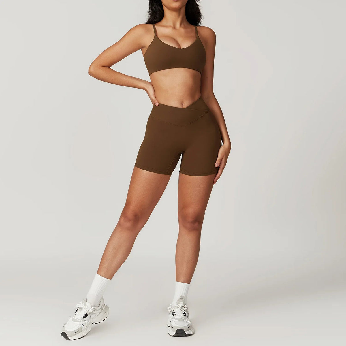 Two-piece women's fitness set with crop top, sports bra, and leggings from The Clothing Company Sydney, perfect for yoga and gym workouts.