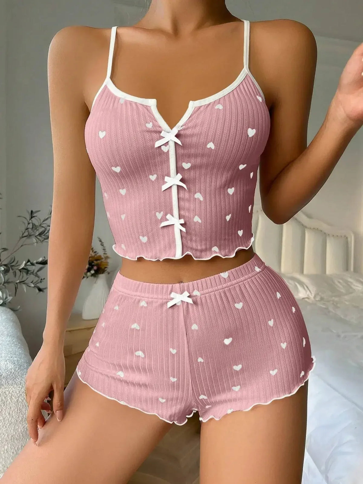Women’s heart print ribbed pyjama set with cami top and shorts featuring frill trim, from The Clothing Company Sydney.