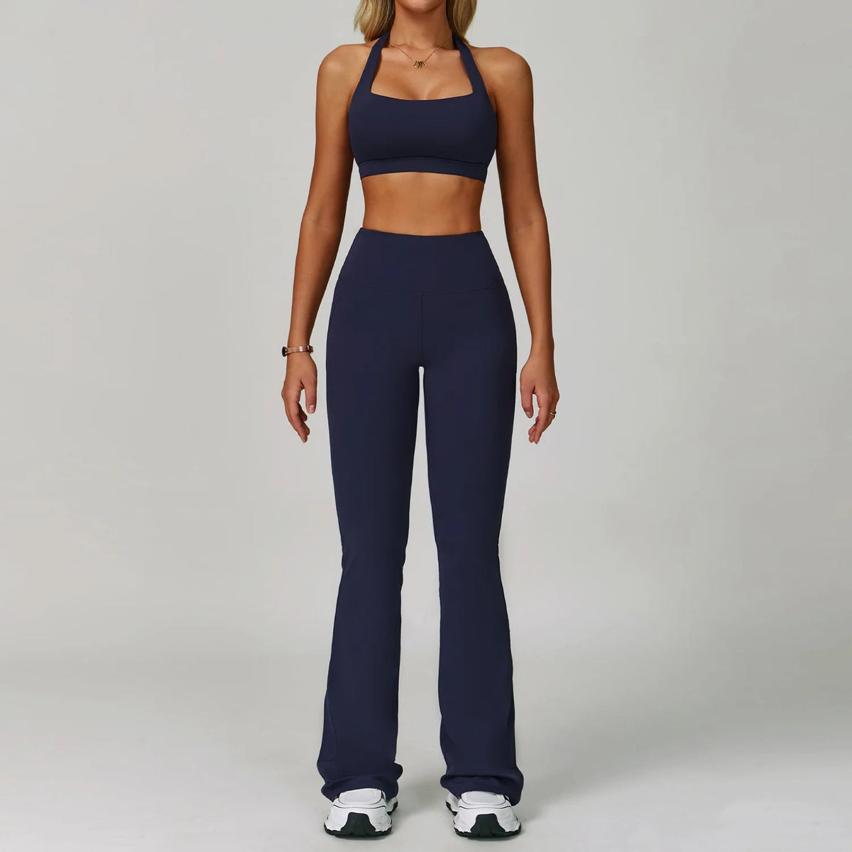 Two-piece women's fitness tracksuit set by The Clothing Company Sydney, includes high-waist leggings and sports bra for yoga and workout.