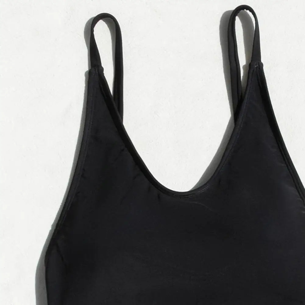 Backless micro thong one-piece swimsuit for women by The Clothing Company Sydney, featuring a sleek design and minimal coverage.