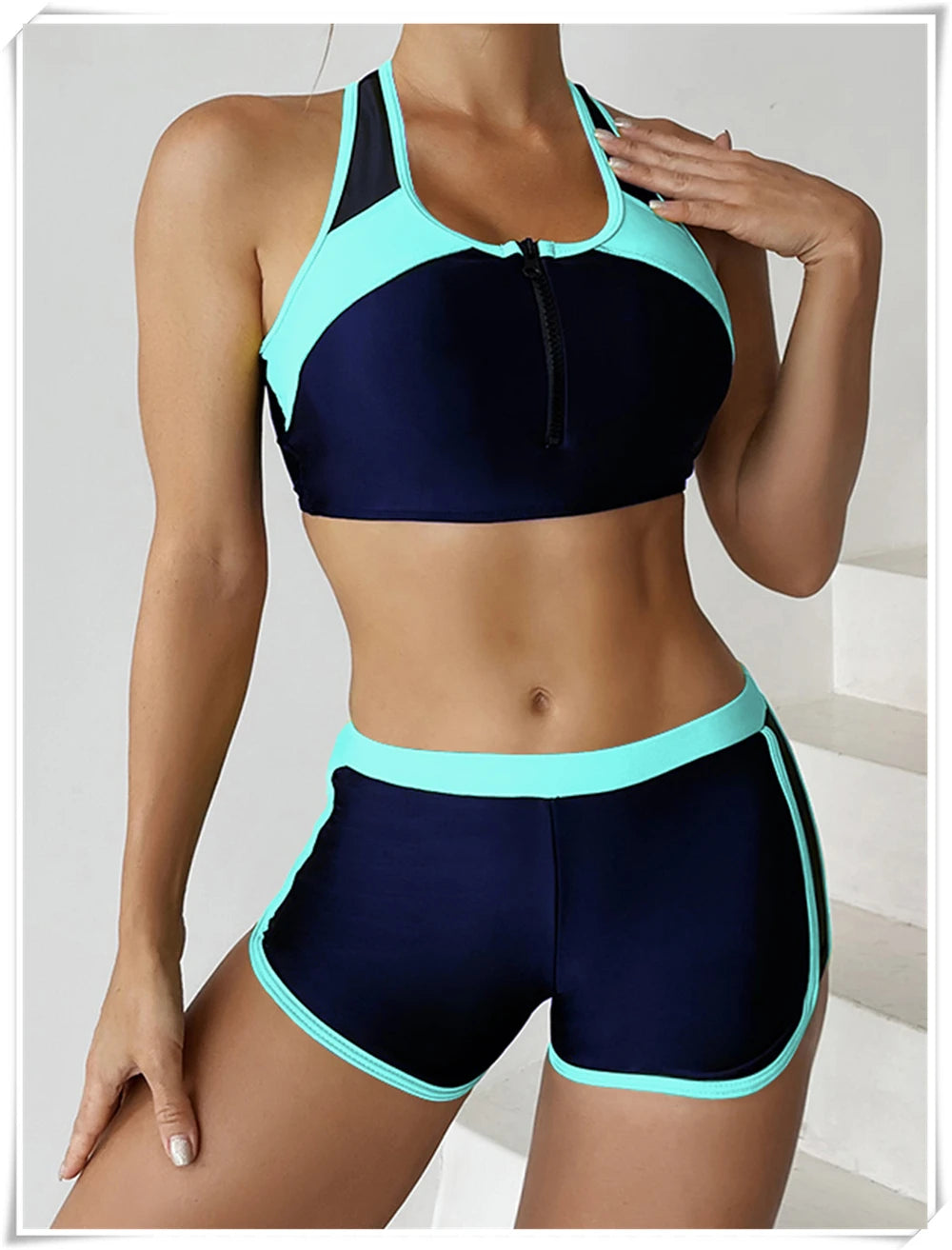 Two-piece swimsuit by The Clothing Company Sydney featuring a zipper tankini top and high-waist shorts for summer beachwear.