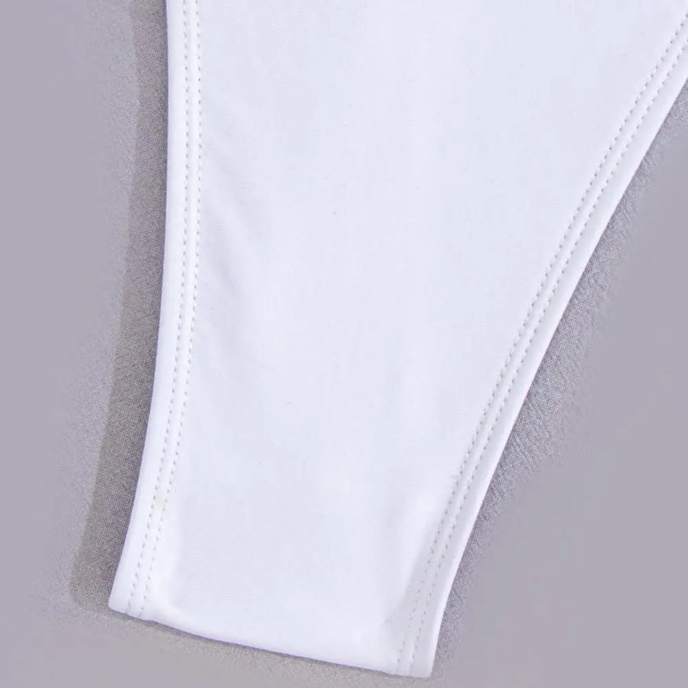 Backless micro thong one-piece swimsuit for women by The Clothing Company Sydney, showcasing a sleek, minimal swimwear design.