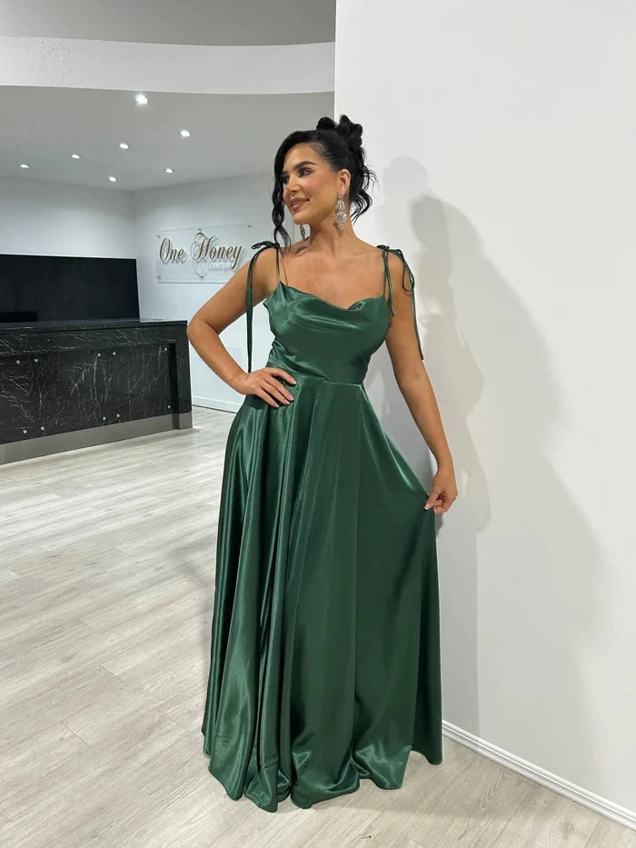 Mint green satin bridesmaid dress with side slit, backless design, spaghetti straps, long evening gown for summer events.