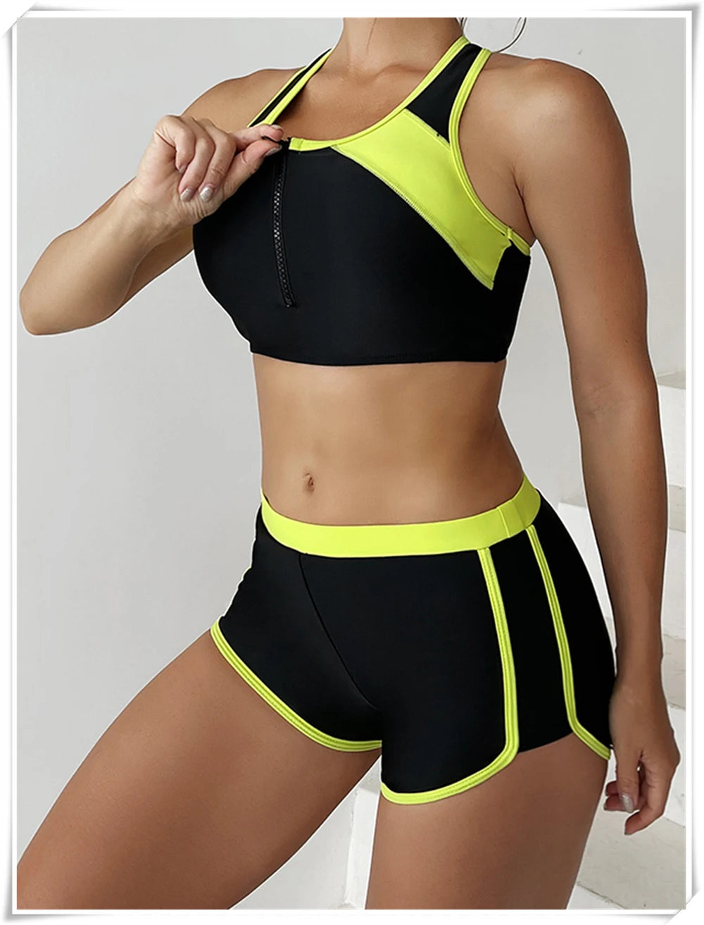 Two-piece swimsuit with zipper tankini top and high-waist shorts, perfect for summer beachwear and swimming activities.