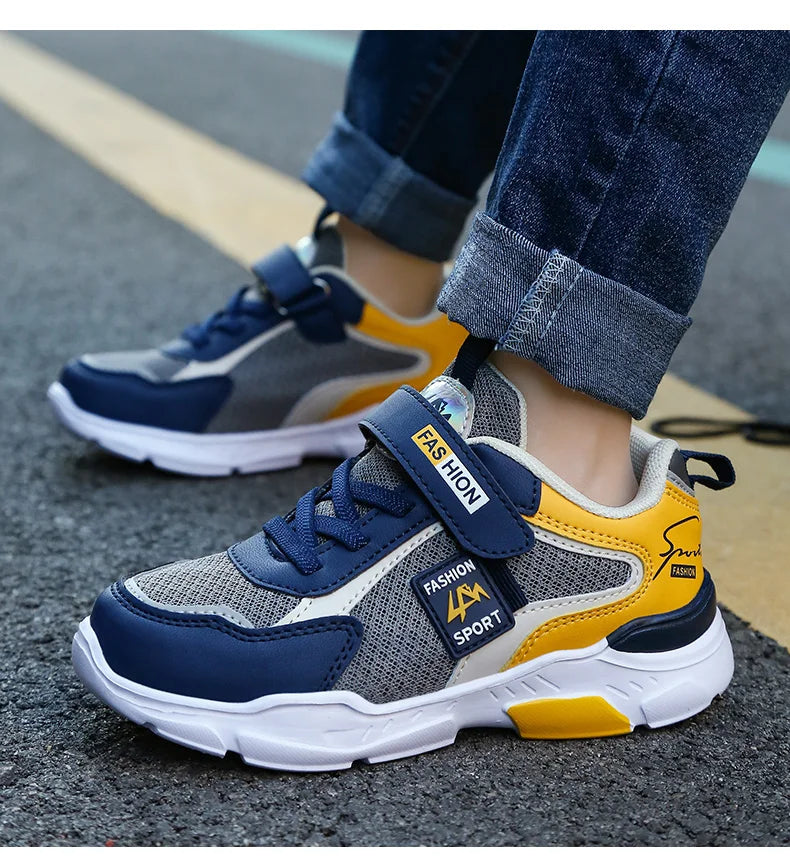 Kids’ breathable summer sneakers by The Clothing Company Sydney, mesh running shoes with hook and loop straps for boys and girls.