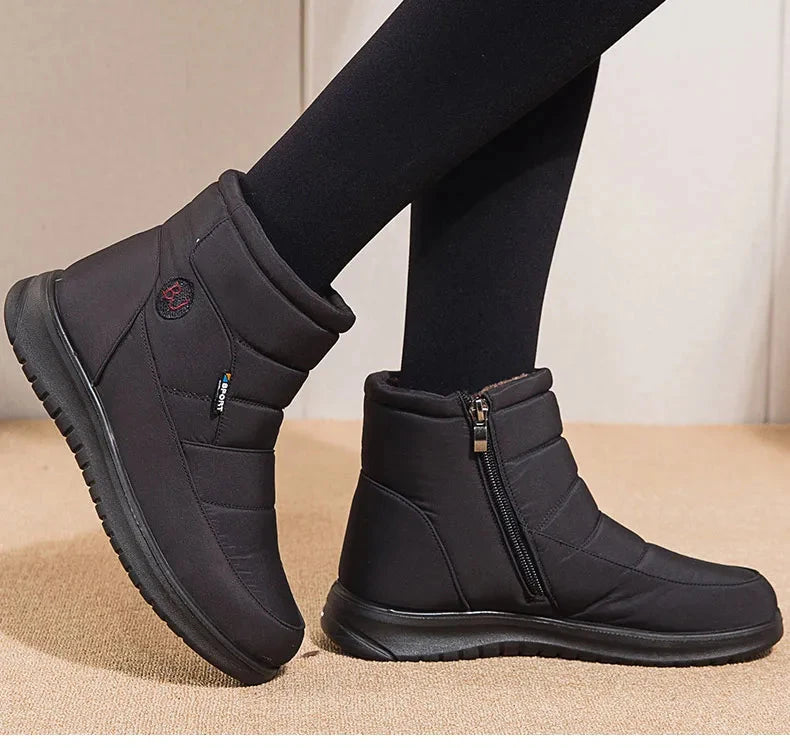 Women’s ankle low heel snow boots by The Clothing Company Sydney, winter flat shoes with a stylish, practical design and snow-resistant features.