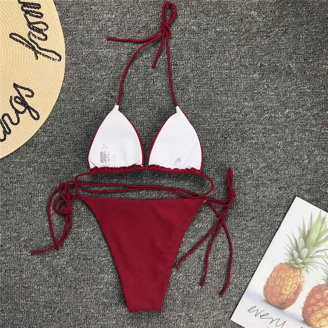 Neon pink Brazilian bikini swimsuit for women, halter two-piece swimwear, stylish bathing suit from The Clothing Company Sydney.