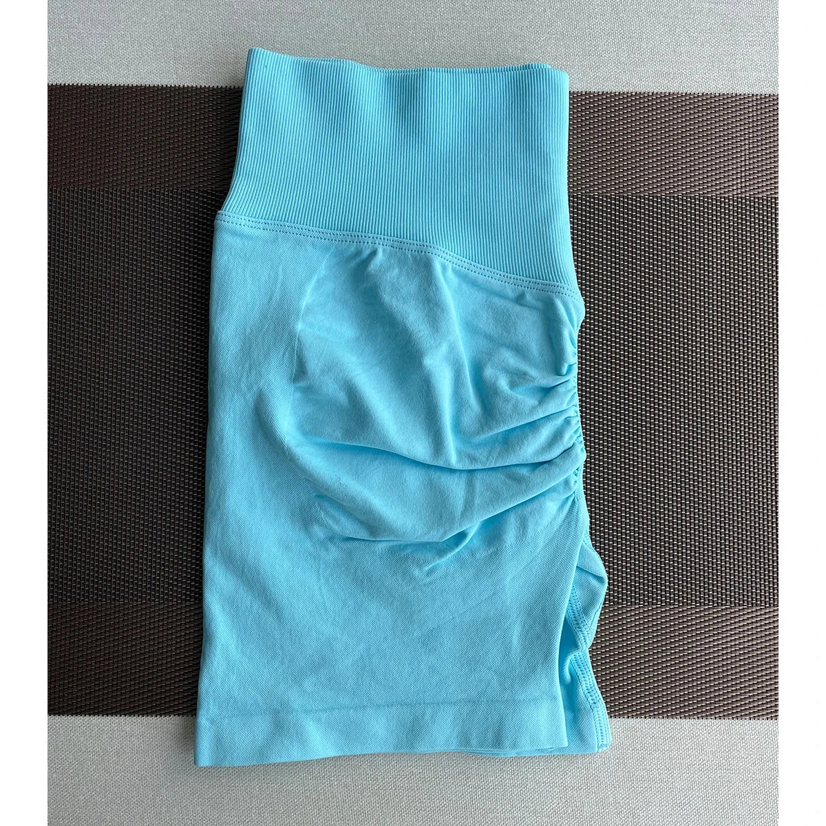 Solid seamless half pants for women by The Clothing Company Sydney, soft fitness shorts ideal for yoga, gym, running, and cycling.