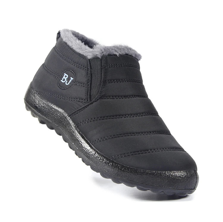 Women’s waterproof fur snow boots from The Clothing Company Sydney, slip-on ankle footwear with plush fur lining for cold weather.