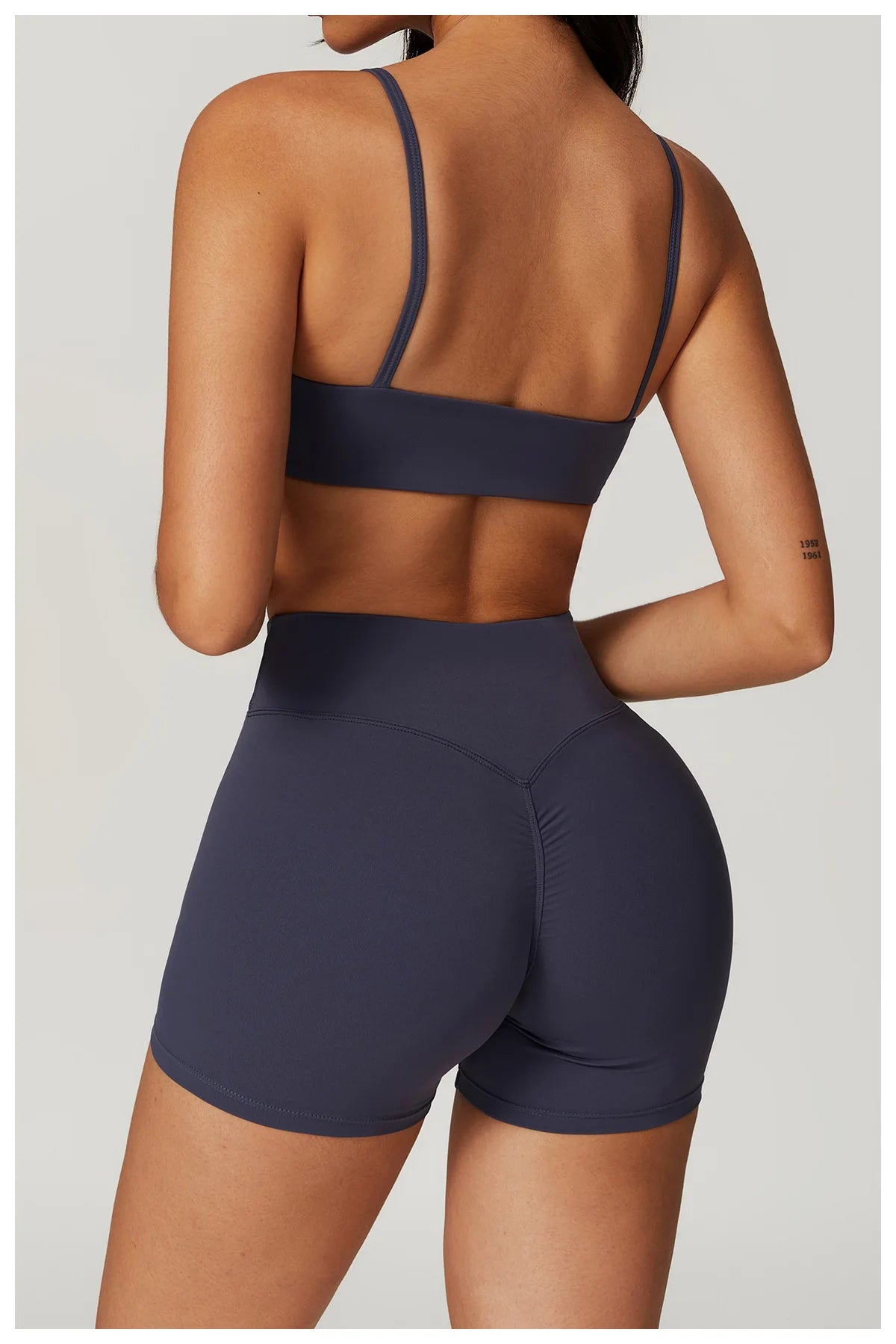 Two-piece women's fitness workout set including a crop top, sports bra, and leggings from The Clothing Company Sydney.