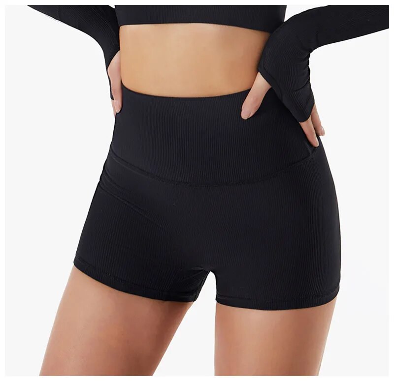 Seamless women's yoga and fitness set with shorts and crop top bra by The Clothing Company Sydney, ideal for running and workouts.