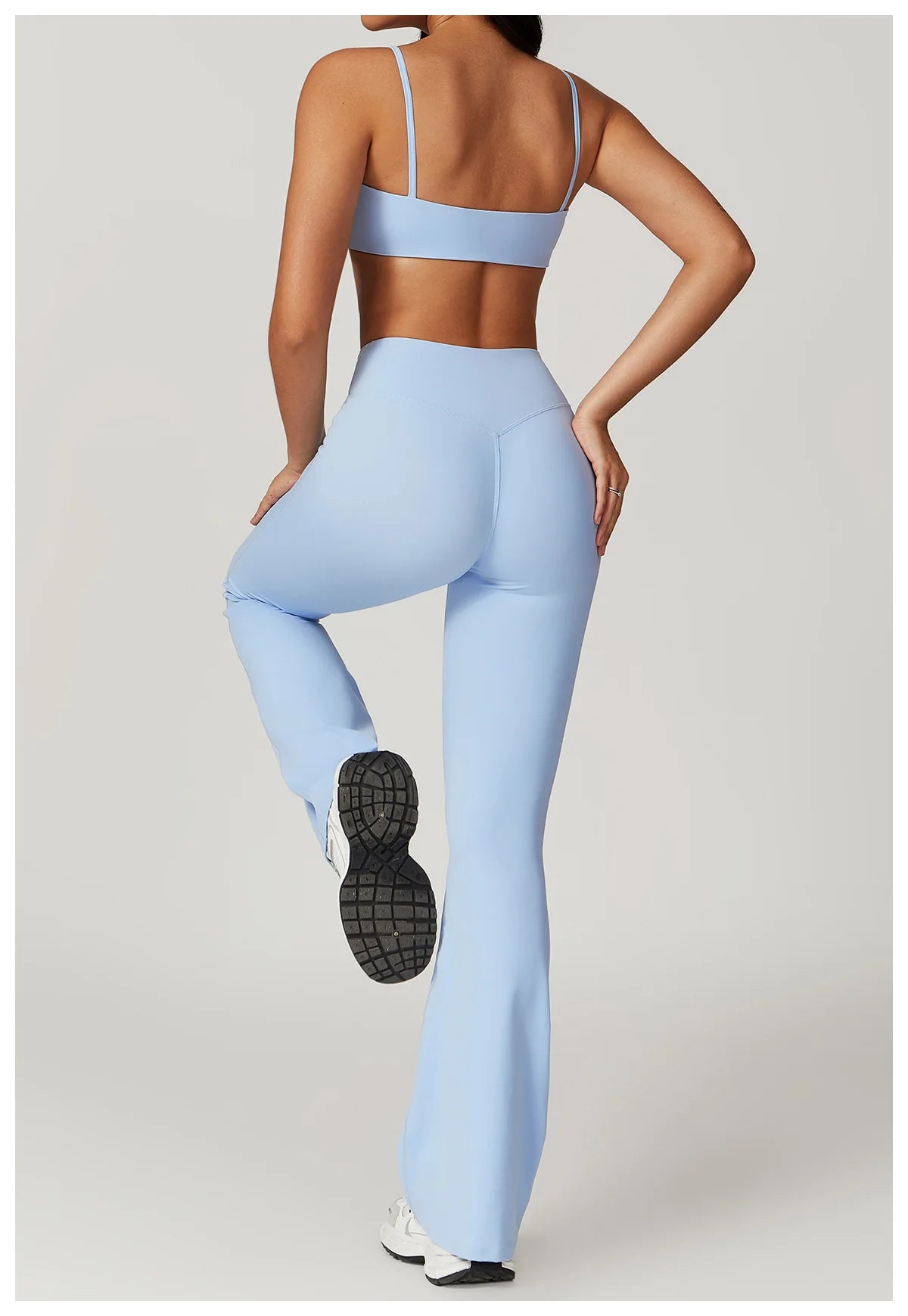 Two-piece women's yoga gym clothes set including a crop top, sports bra, and leggings from The Clothing Company Sydney.