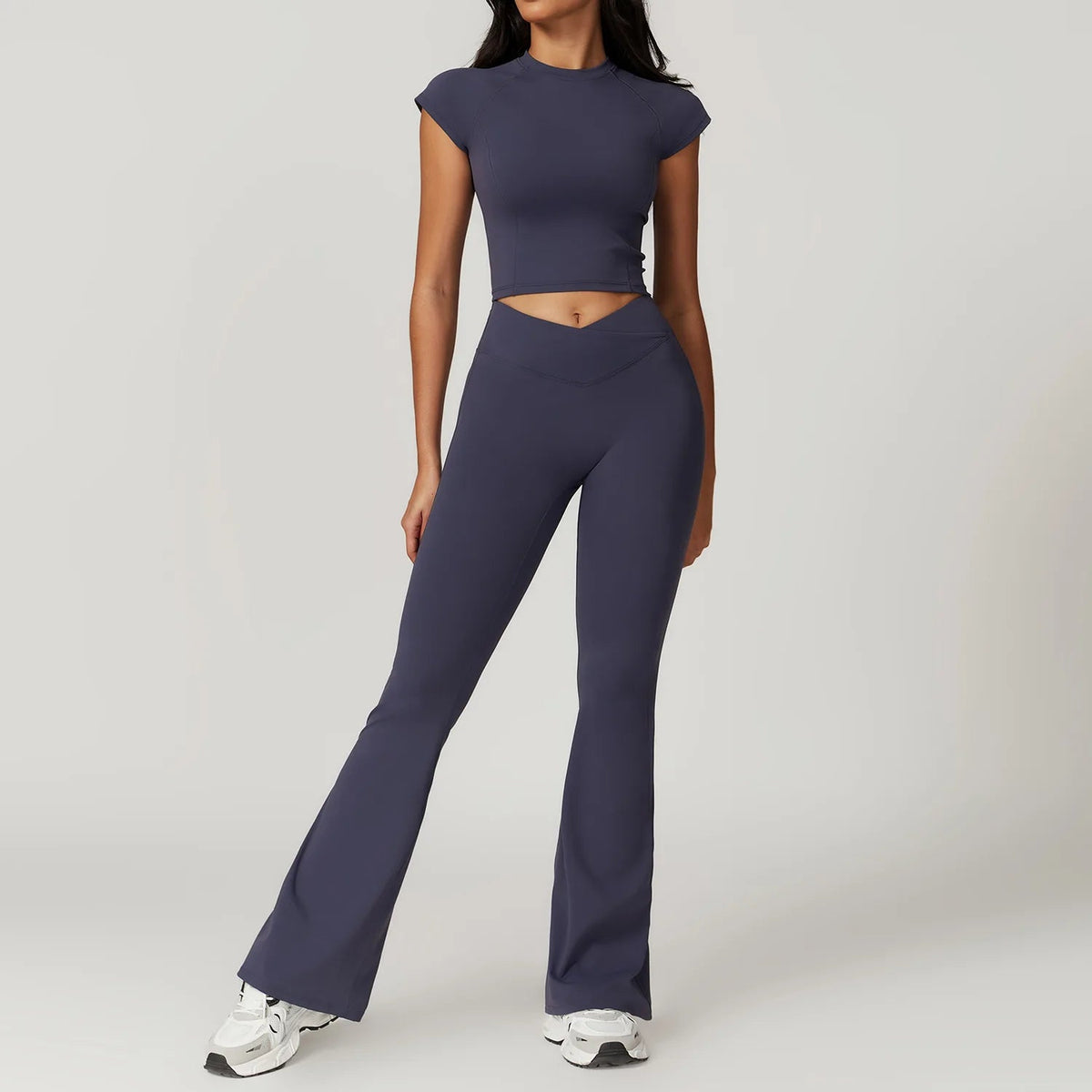 Two-piece women's yoga fitness set with short sleeve crop top, sports bra, and gym leggings from The Clothing Company Sydney.