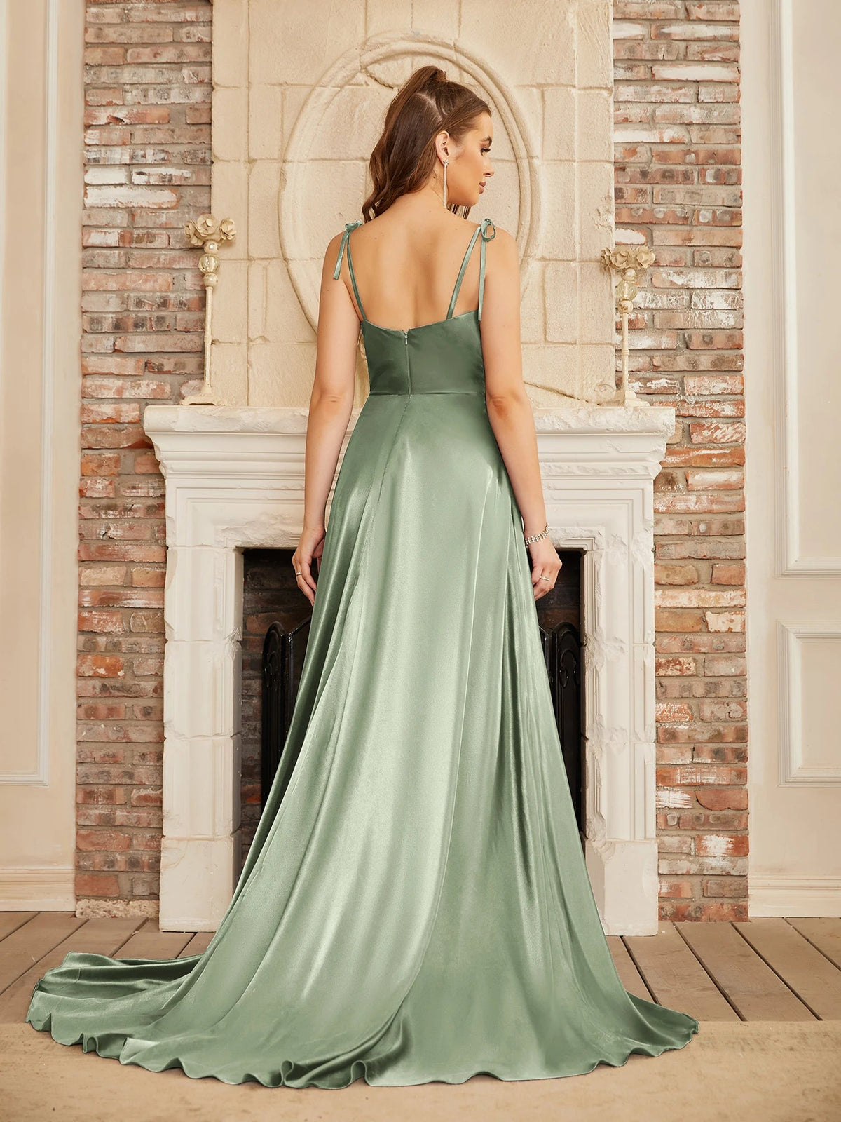 Mint green satin bridesmaid gown with side slit, backless design, spaghetti straps, long summer evening wedding dress by The Clothing Company Sydney
