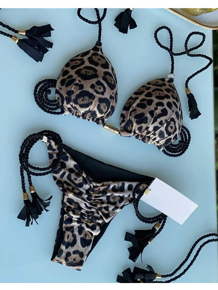Backless women's bikini with rope triangle top, swimwear by The Clothing Company Sydney, shown on a model.