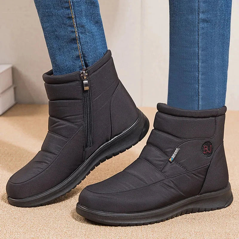 Women’s ankle low heel snow boots by The Clothing Company Sydney, winter flat footwear with a cozy, insulated design.