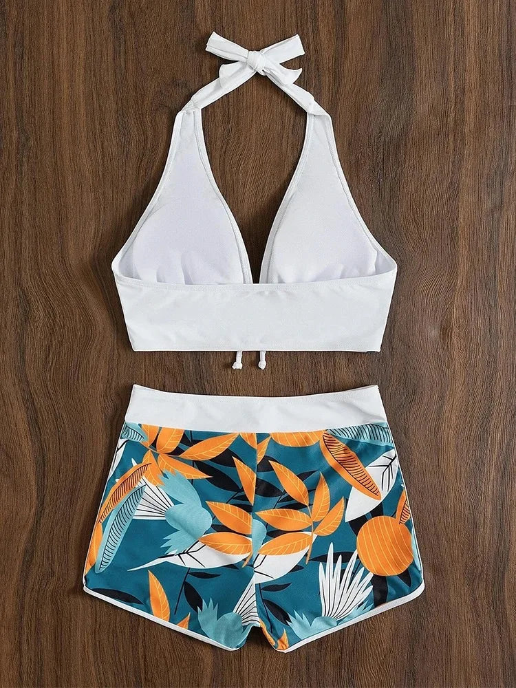 High-waist printed halter bikini set by The Clothing Company Sydney, featuring a stylish short swimsuit for women’s beachwear.