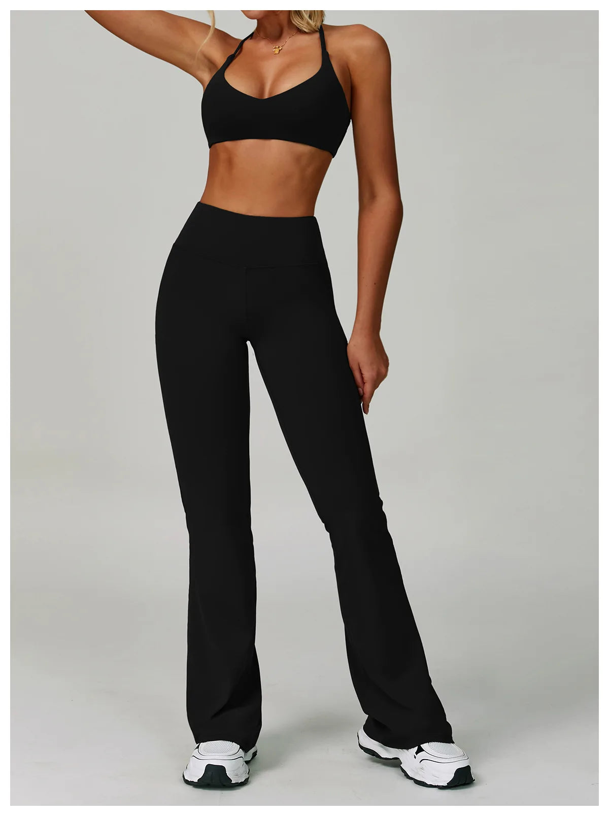 Women's fitness tracksuit set from The Clothing Company Sydney featuring high waist leggings and a supportive workout bra.