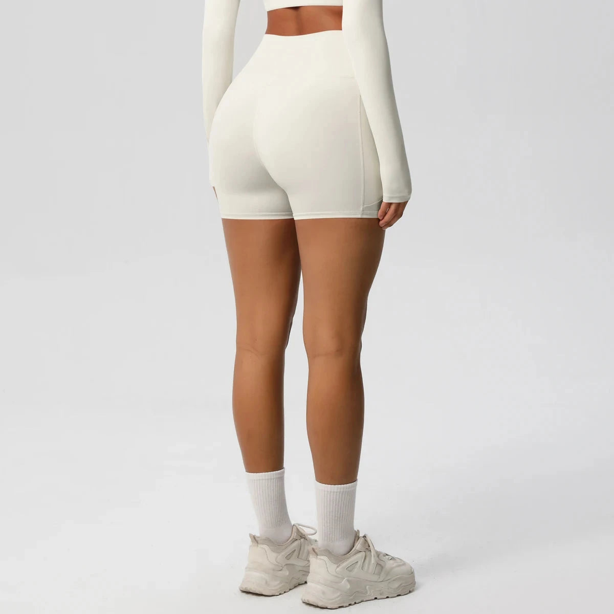 High-waisted bicycle yoga shorts by The Clothing Company Sydney, quick-drying, breathable gym pants with pockets for women.