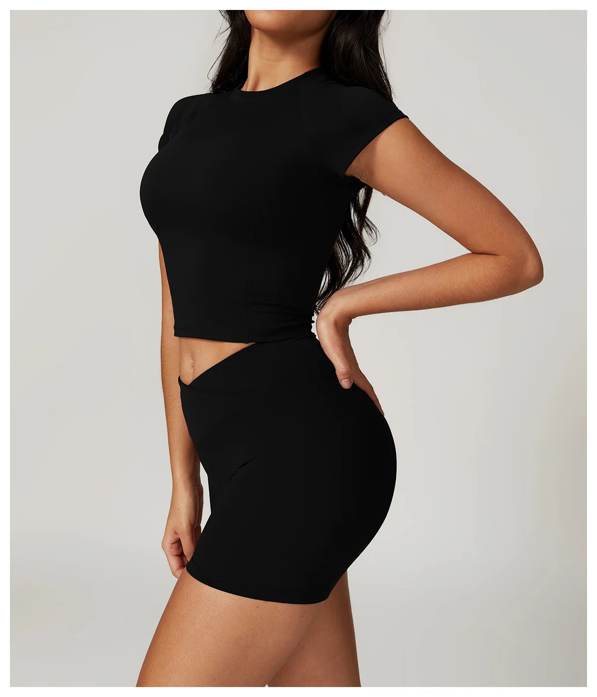 Two-piece women's fitness outfit with short sleeve crop top, sports bra, leggings, and bike shorts from The Clothing Company Sydney.