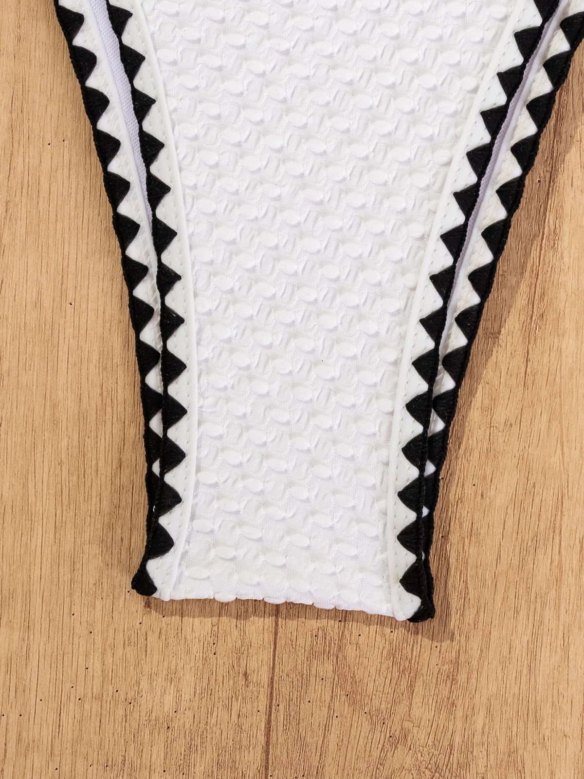 White knitted 2-piece bikini for women with patchwork design, push-up style, Brazilian cut, perfect for summer beachwear.