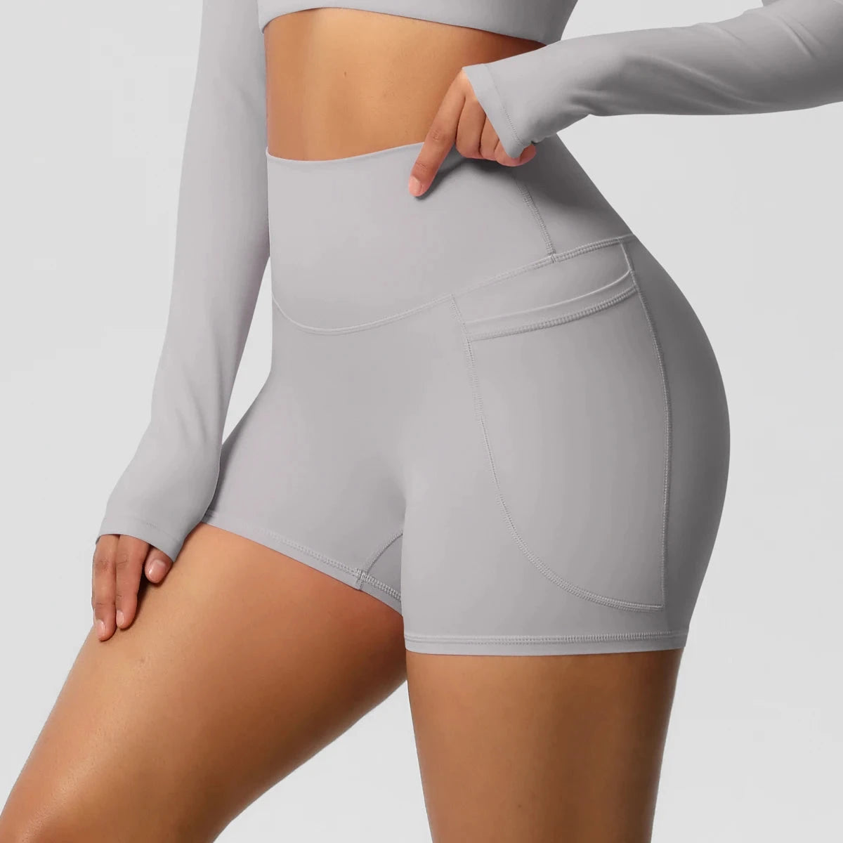 High-waisted bicycle yoga pants from The Clothing Company Sydney featuring pockets, quick-drying, breathable fabric for women’s workout.