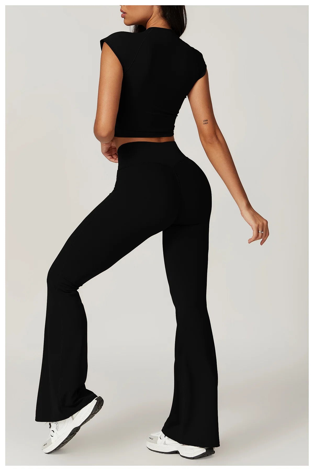 Two-piece women's fitness set including a crop top, sports bra, and leggings from The Clothing Company Sydney, ideal for yoga and gym workouts.